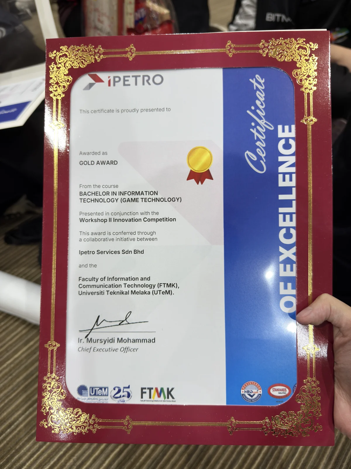 Close-up of the iPETRO Gold Award certificate